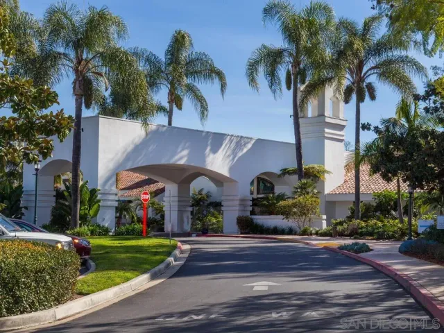 a front view of a house with a garden and a yard