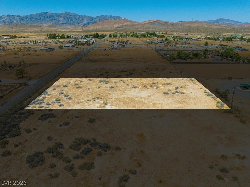 4580 Lawrence Road Pahrump, NV 89048 - Photo 21 of 40 A vast, undeveloped parcel awaits your vision amidst distant mountains and a tranquil community.