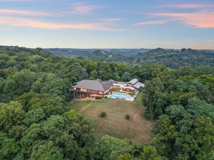 an aerial view of a house with mountain view