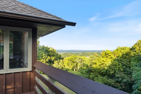 a view of a balcony with an outdoor space