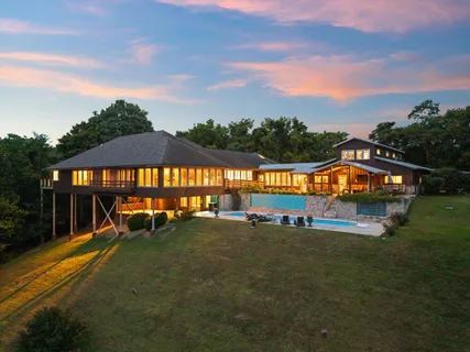 a view of a house with a yard porch and sitting area