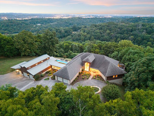 an aerial view of a house with a garden