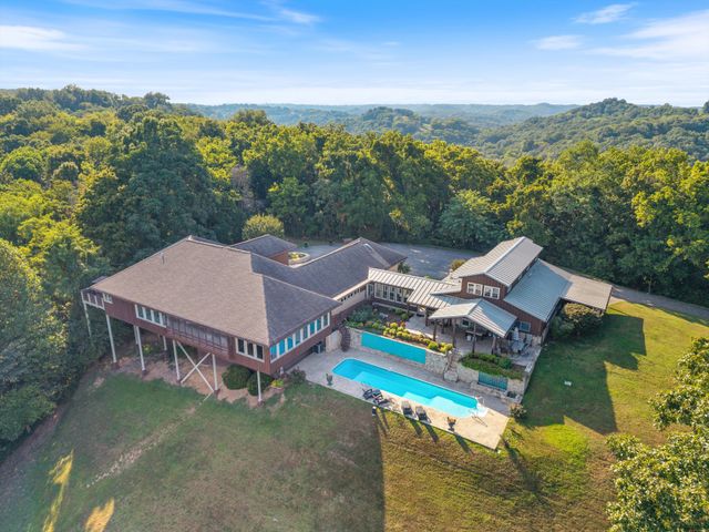 an aerial view of a house with a garden