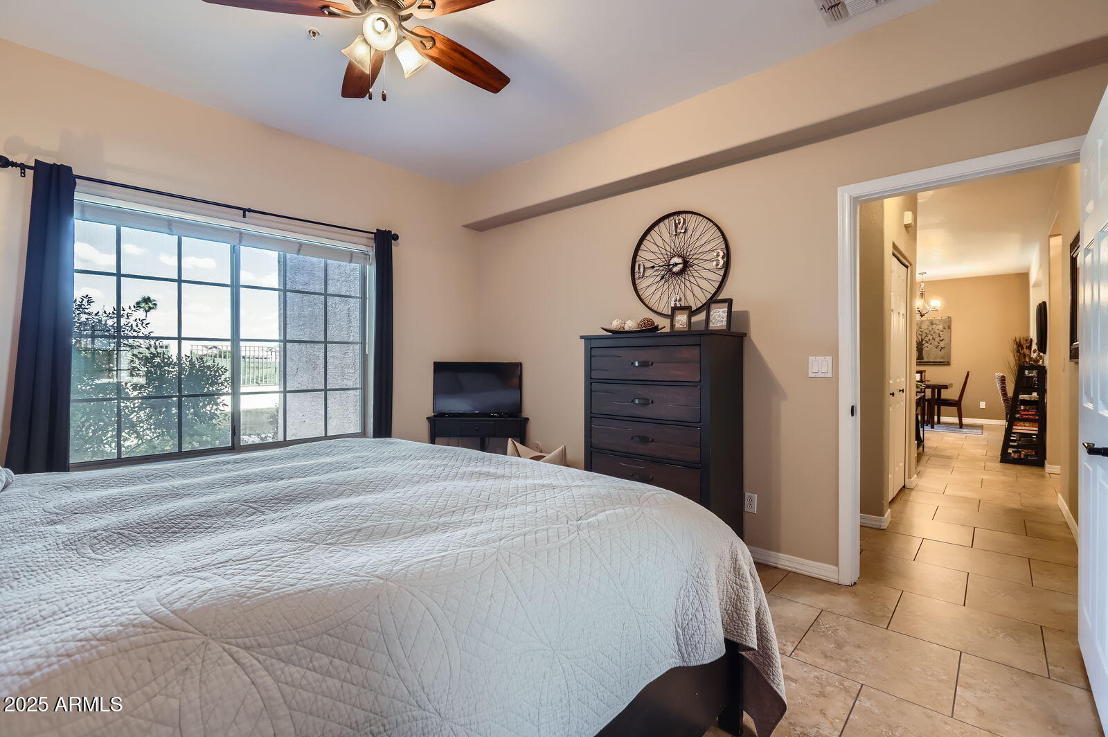 2801 North Litchfield Road, Unit 65 Goodyear, AZ 85395 - Photo 15 of 30 a bedroom with a bed and a chandelier