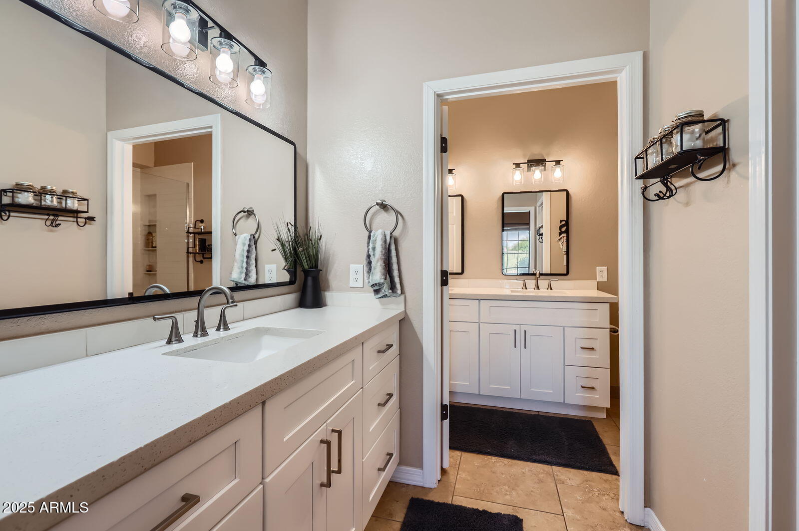 2801 North Litchfield Road, Unit 65 Goodyear, AZ 85395 - Photo 16 of 30 a bathroom with a sink vanity and mirror