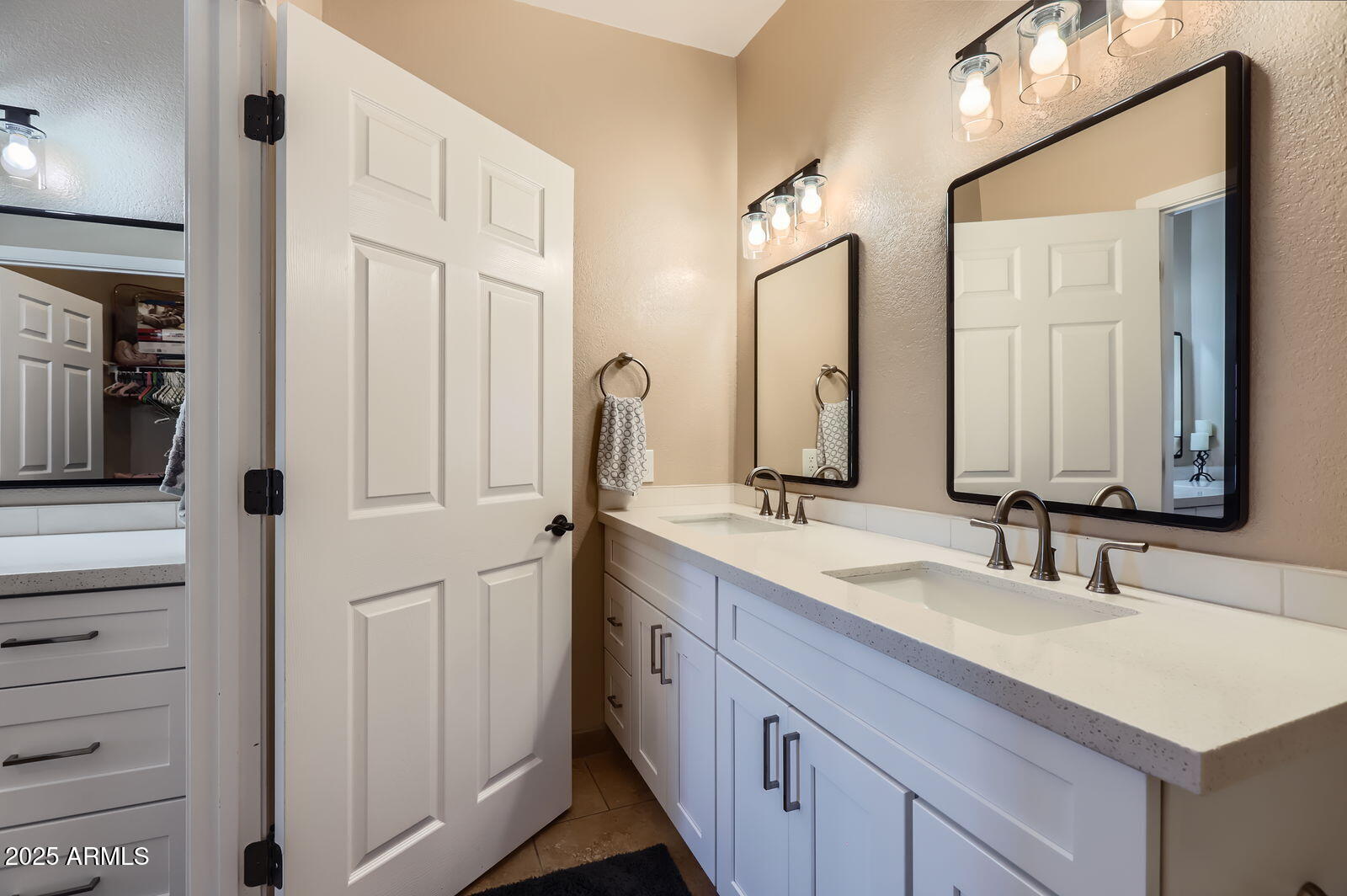 2801 North Litchfield Road, Unit 65 Goodyear, AZ 85395 - Photo 17 of 30 a bathroom with double vanity and a mirror