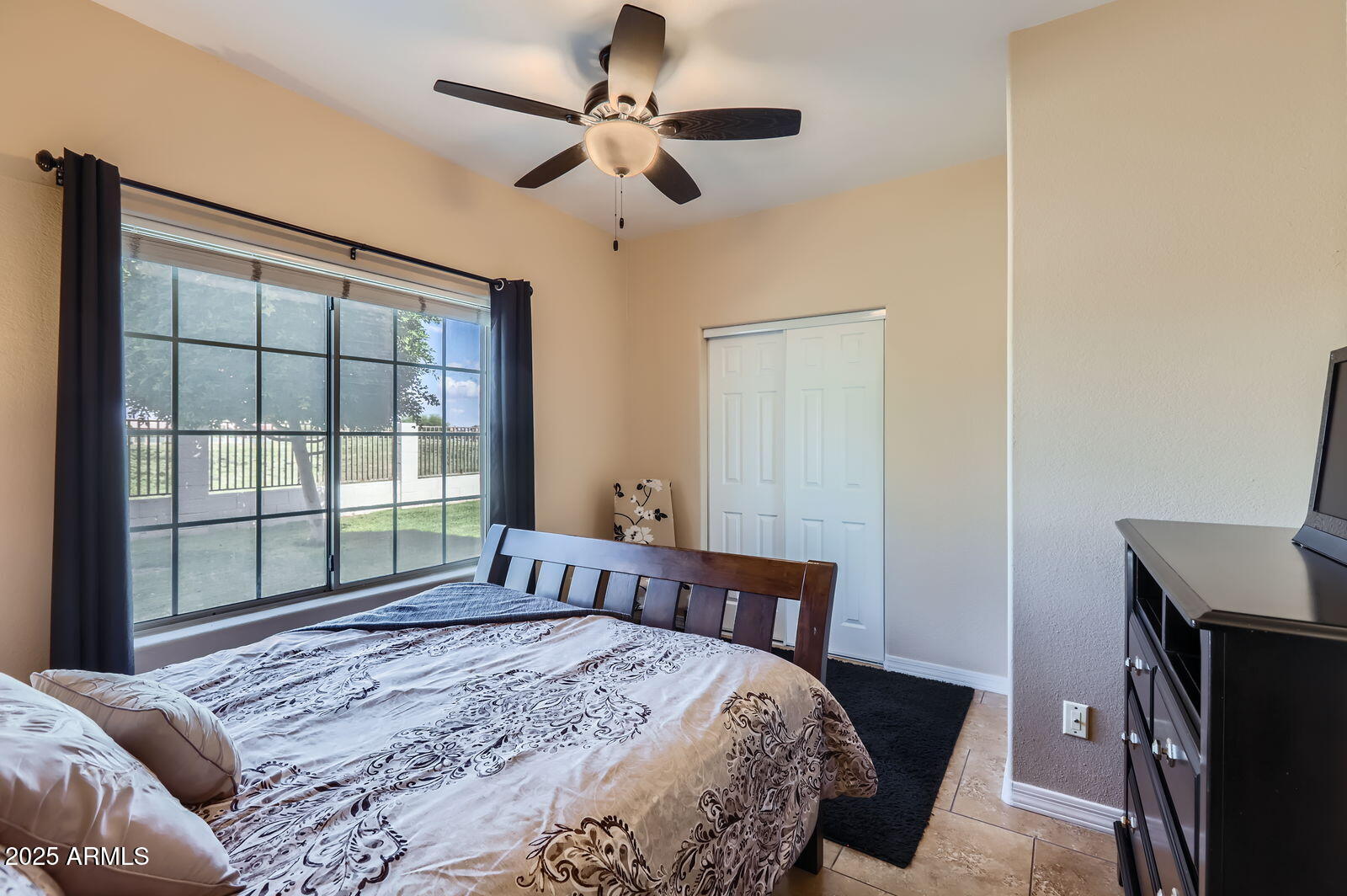 2801 North Litchfield Road, Unit 65 Goodyear, AZ 85395 - Photo 19 of 30 a bedroom with a bed and a window