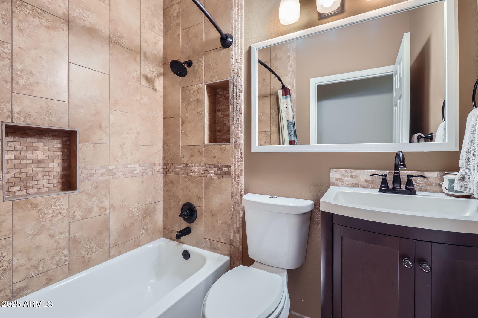 2801 North Litchfield Road, Unit 65 Goodyear, AZ 85395 - Photo 20 of 30 a bathroom with a sink a toilet and shower