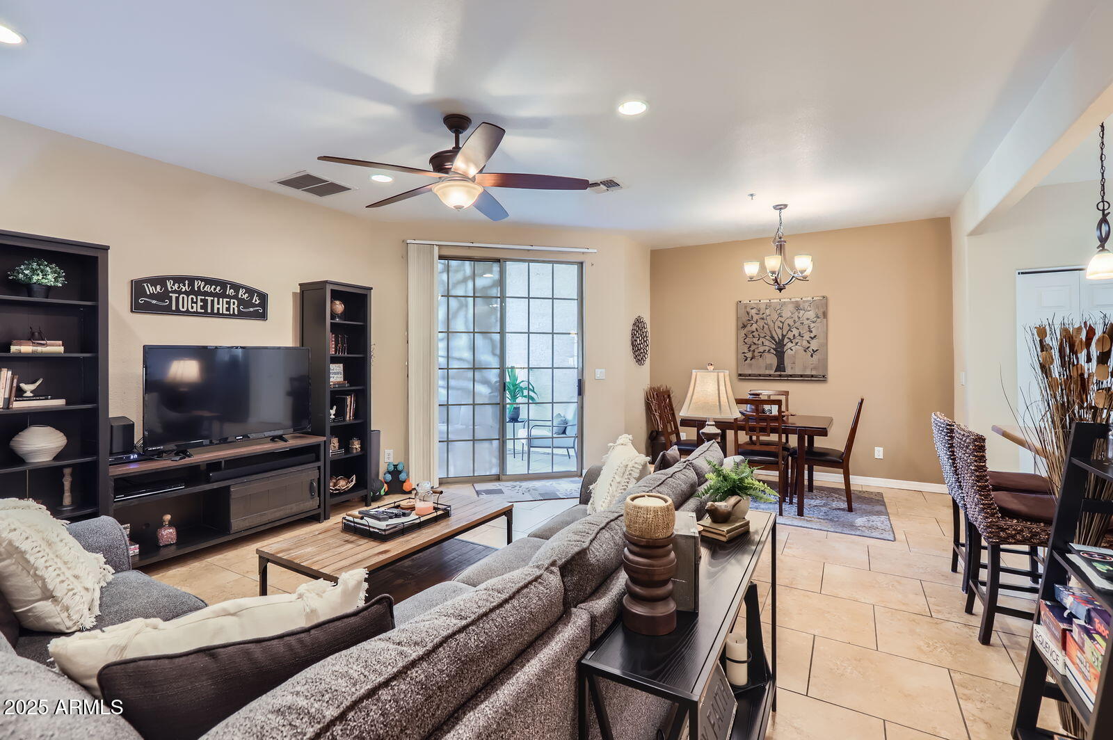 2801 North Litchfield Road, Unit 65 Goodyear, AZ 85395 - Photo 2 of 30 a living room with furniture and a flat screen tv