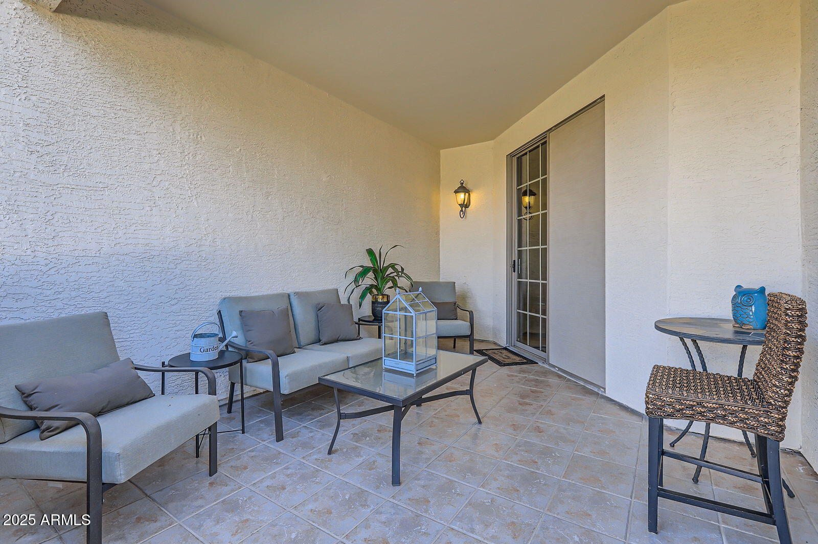 2801 North Litchfield Road, Unit 65 Goodyear, AZ 85395 - Photo 23 of 30 a living room with furniture and a potted plant