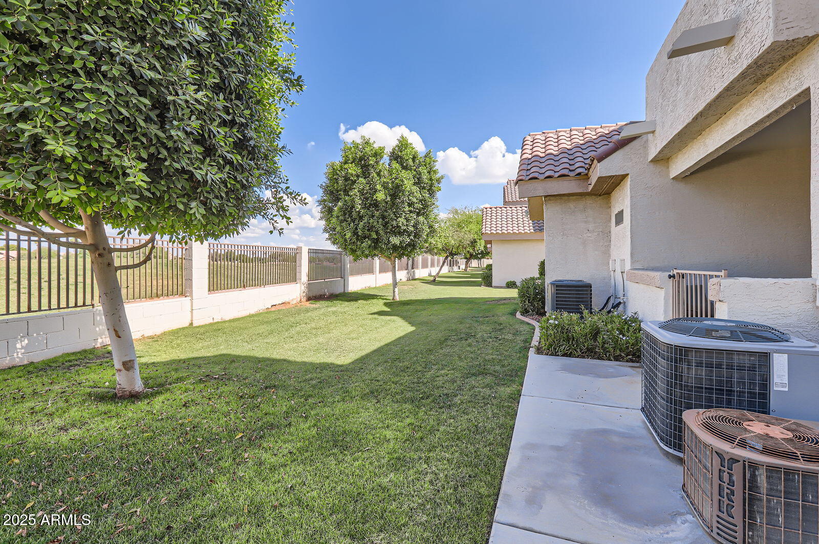 2801 North Litchfield Road, Unit 65 Goodyear, AZ 85395 - Photo 24 of 30 a front view of a house with garden