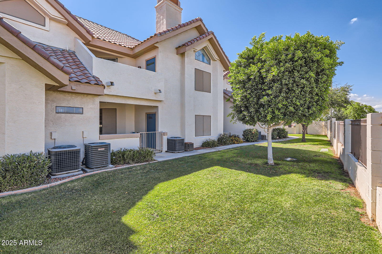 2801 North Litchfield Road, Unit 65 Goodyear, AZ 85395 - Photo 25 of 30 a swimming pool with yard and outdoor seating