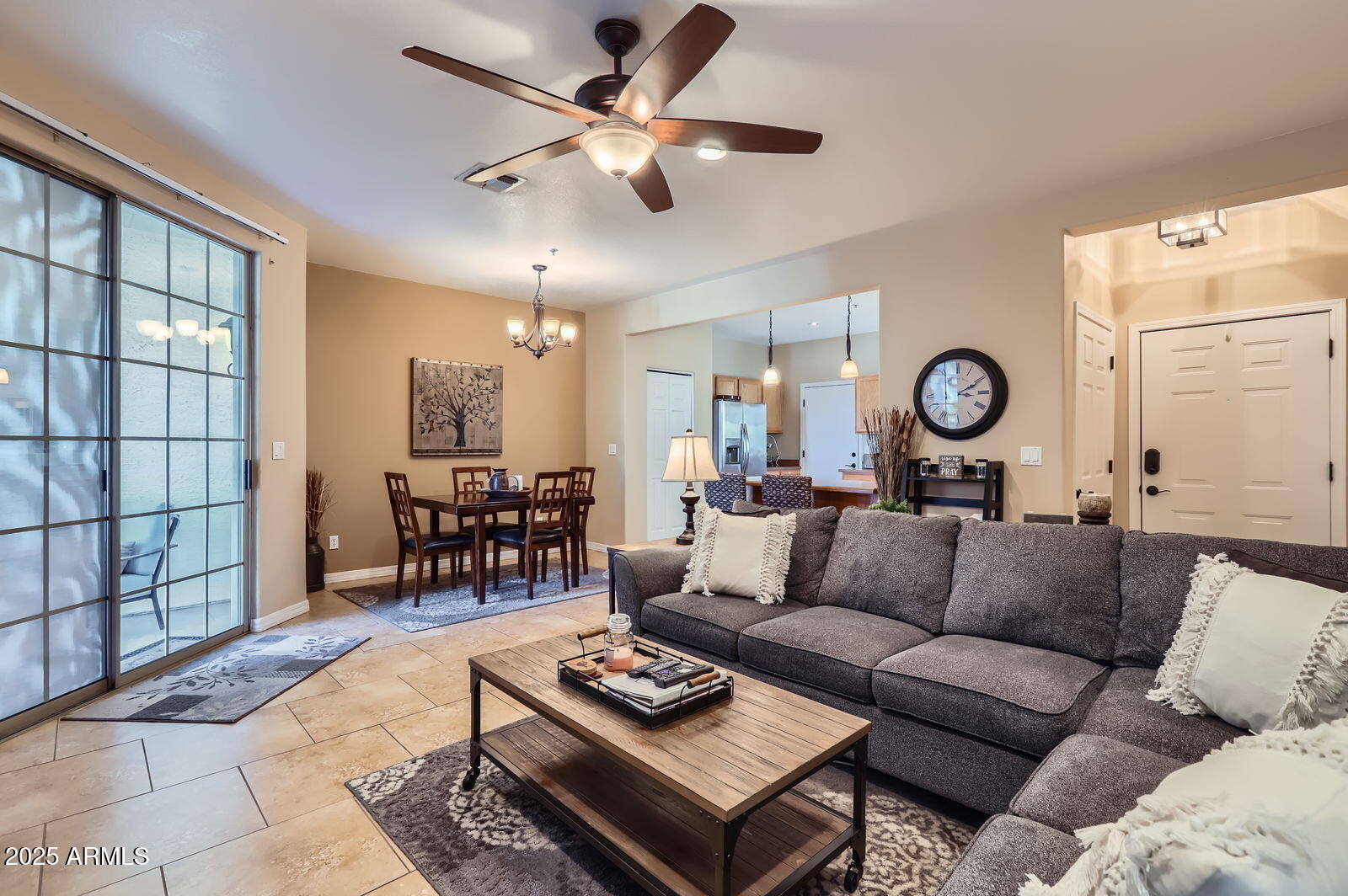 2801 North Litchfield Road, Unit 65 Goodyear, AZ 85395 - Photo 5 of 30 a living room with furniture and a large window