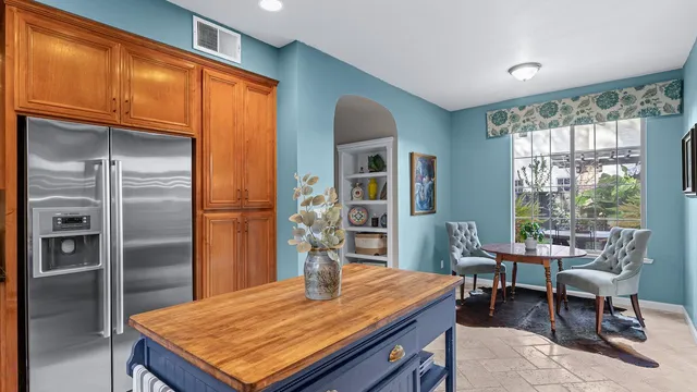 a living room with furniture a fireplace and wooden floor