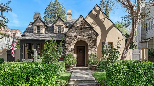 a view of a house with a tree