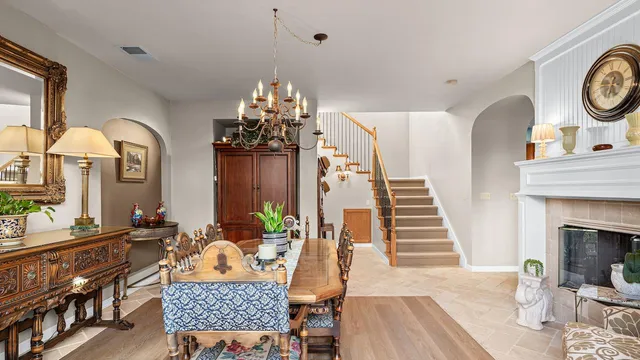 a view of a livingroom with furniture and staircase