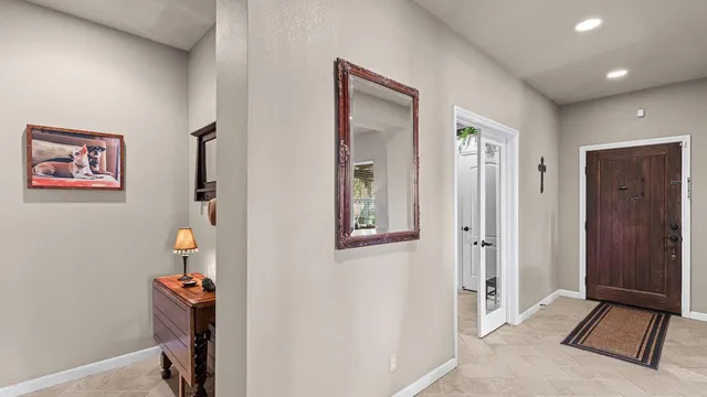 a bathroom with sink a mirror and a shower