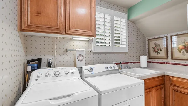 a bedroom with a large bed and a ceiling fan