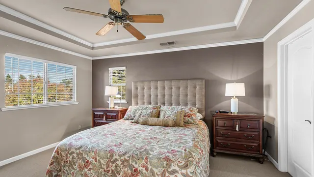 a living room filled with furniture and a floor to ceiling window