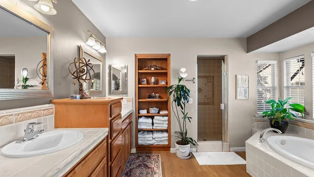 a view of a patio with table and chairs under an umbrella