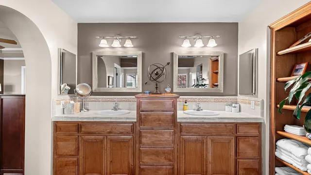 a view of a patio with table and chairs potted plants