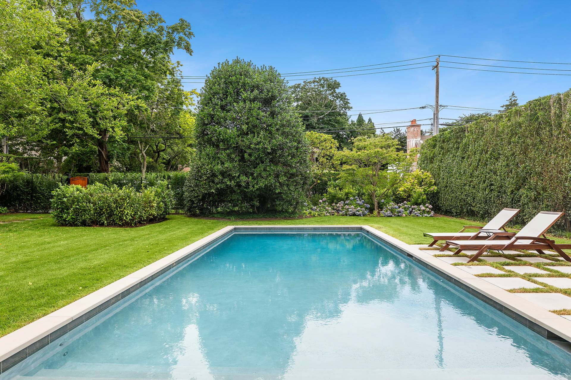 50 Sherrill Road East Hampton, NY 11937 - Photo 18 of 20 a view of a balcony with a yard