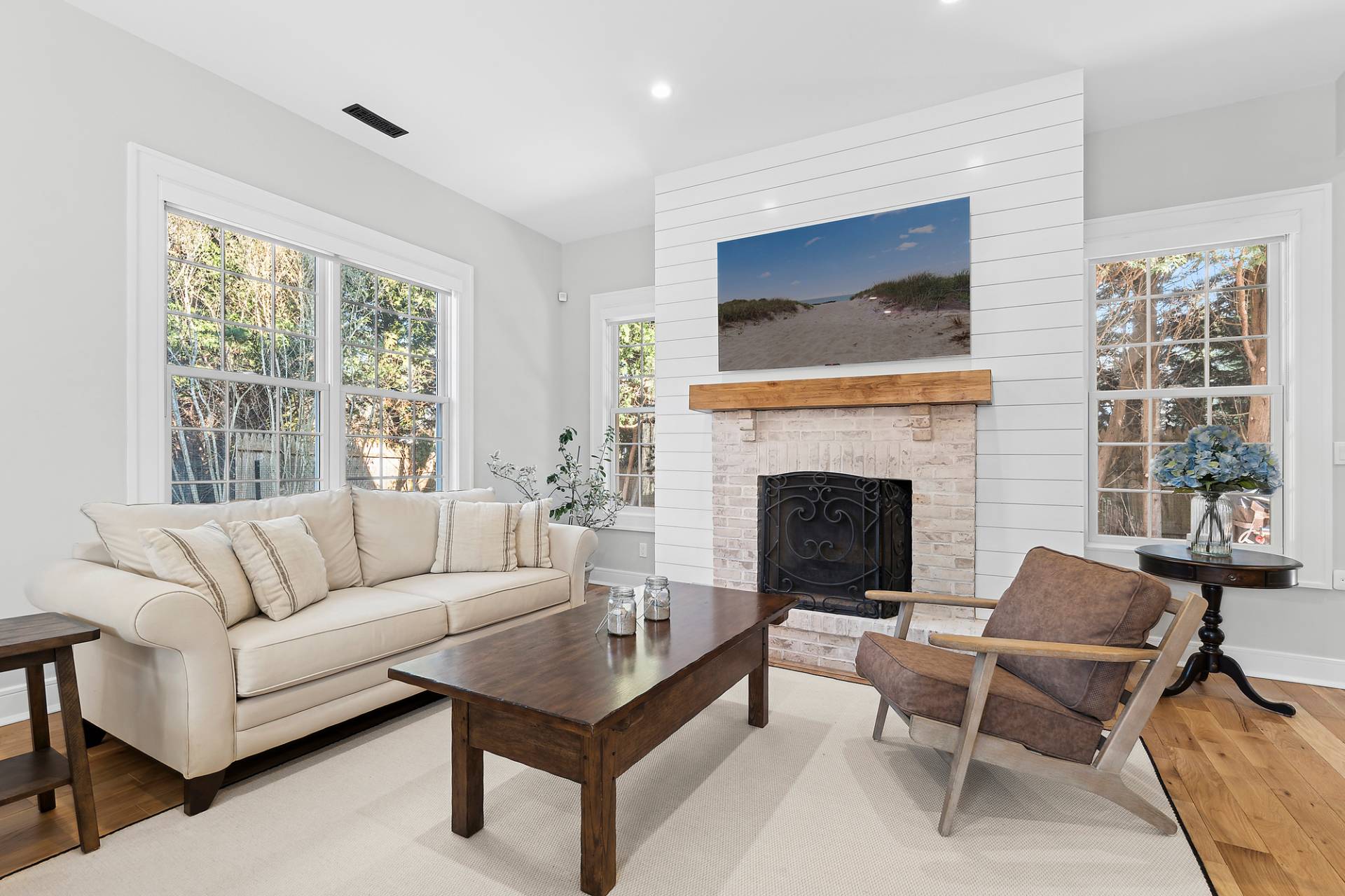 50 Sherrill Road East Hampton, NY 11937 - Photo 3 of 20 a living room with furniture a flat screen tv and a fireplace