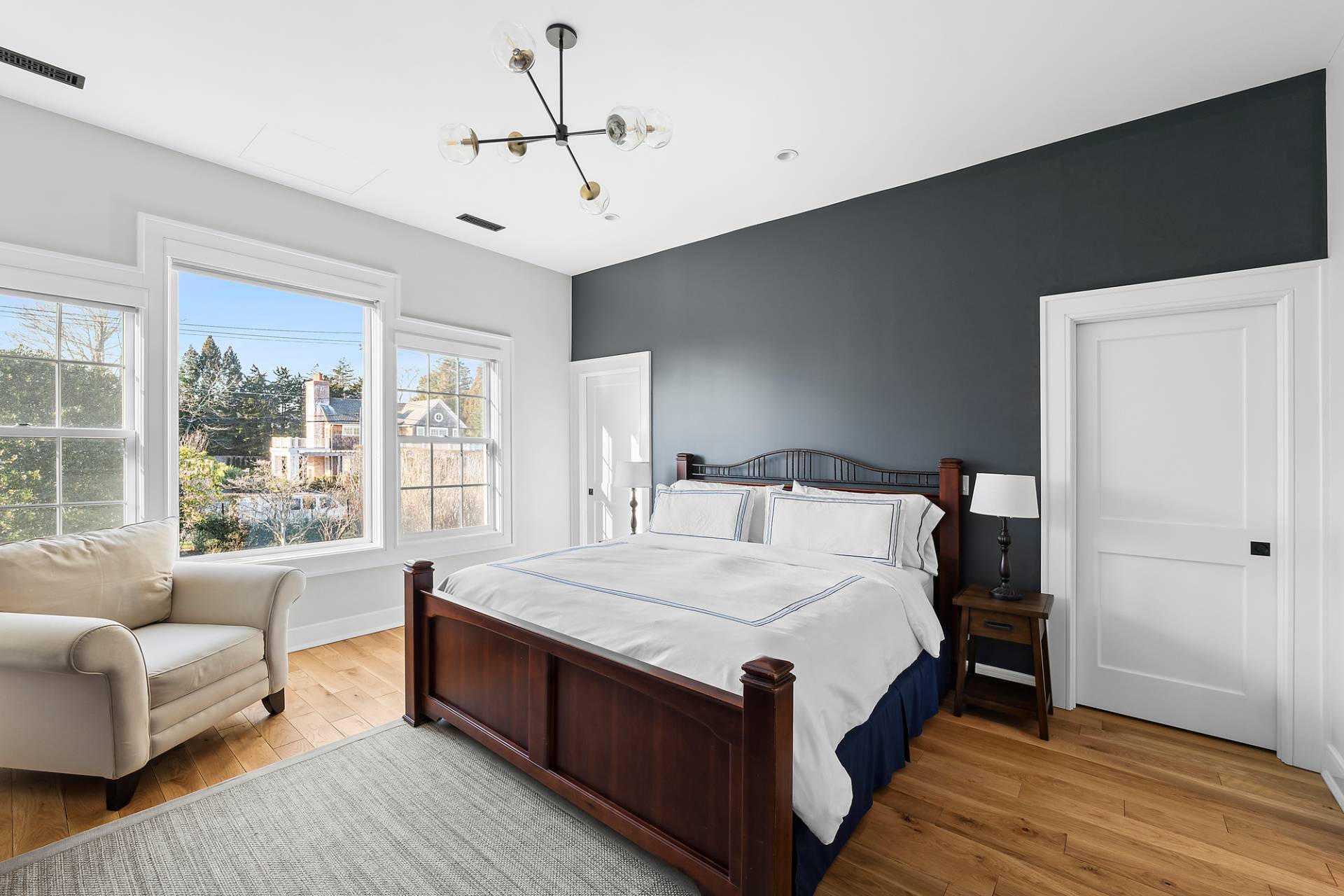 50 Sherrill Road East Hampton, NY 11937 - Photo 7 of 20 a large bedroom with a bed and a couch