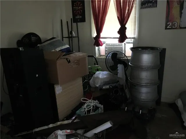 a room with water heater and wooden floor