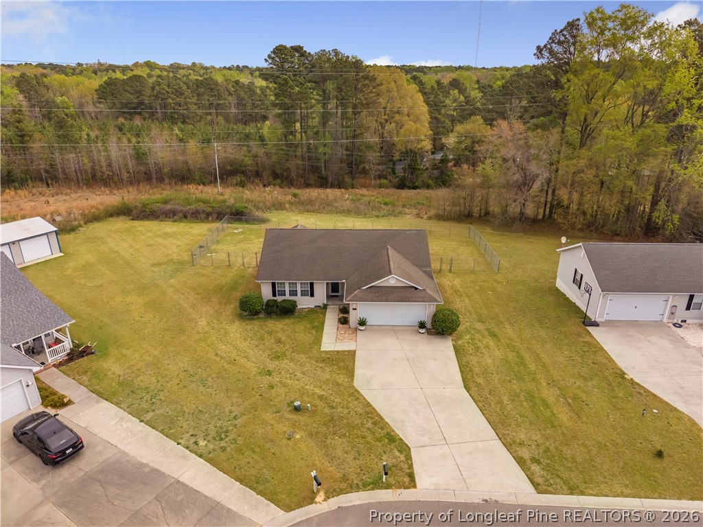 253 Farmstead Court Rockingham, NC 28379 - Photo 2 of 25 a view of a swimming pool with a yard