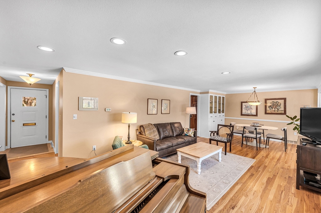 361 Frank Smith Road Longmeadow, MA 01106 - Photo 17 of 42 a living room with furniture and a flat screen tv