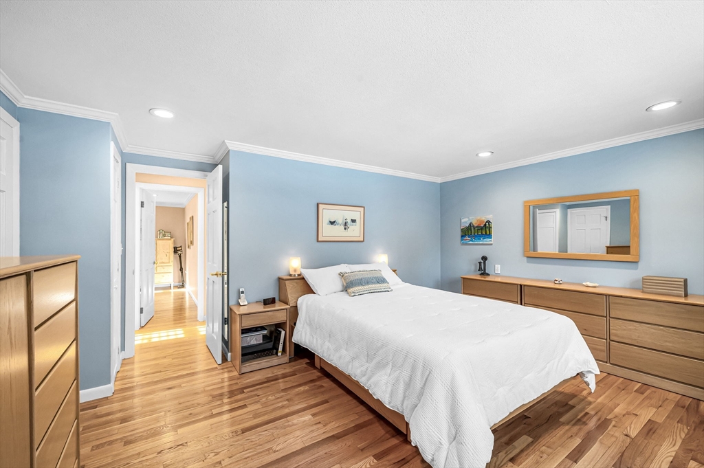 361 Frank Smith Road Longmeadow, MA 01106 - Photo 19 of 42 a bedroom with a bed and a painting on the wall