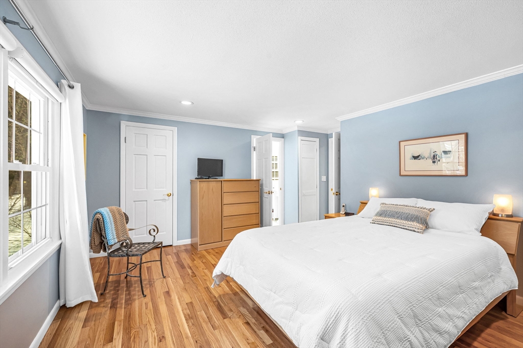 361 Frank Smith Road Longmeadow, MA 01106 - Photo 20 of 42 a bedroom with a bed and wooden floor