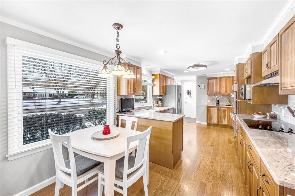 361 Frank Smith Road Longmeadow, MA 01106 - Photo 2 of 42 a dining room with stainless steel appliances kitchen island granite countertop a dining table chairs and a living room view