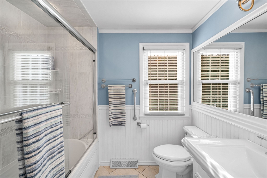 361 Frank Smith Road Longmeadow, MA 01106 - Photo 21 of 42 a bathroom with a sink a toilet a mirror and a window