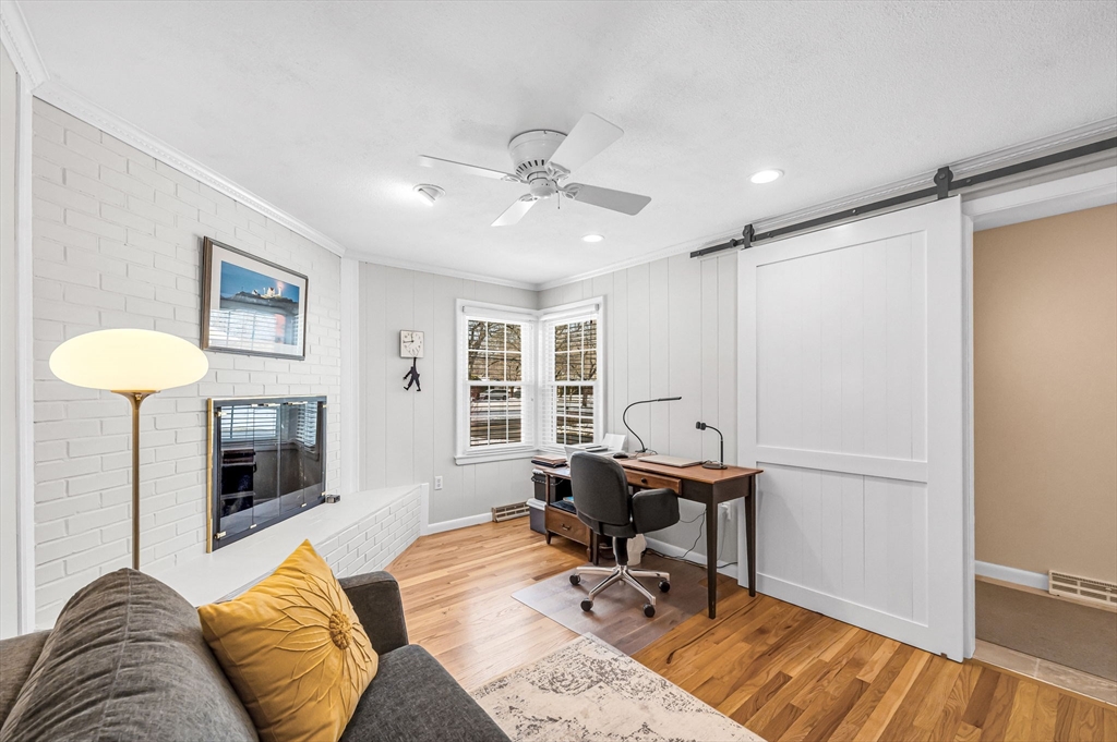361 Frank Smith Road Longmeadow, MA 01106 - Photo 27 of 42 a living room with furniture and a fireplace