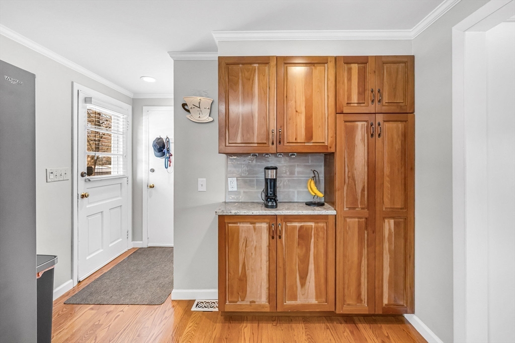 361 Frank Smith Road Longmeadow, MA 01106 - Photo 3 of 42 a view of a kitchen with wooden floor and a window
