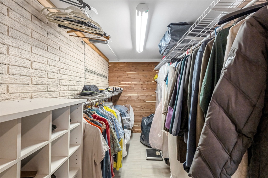 361 Frank Smith Road Longmeadow, MA 01106 - Photo 33 of 42 a view of walk in closet with clothes and shoes