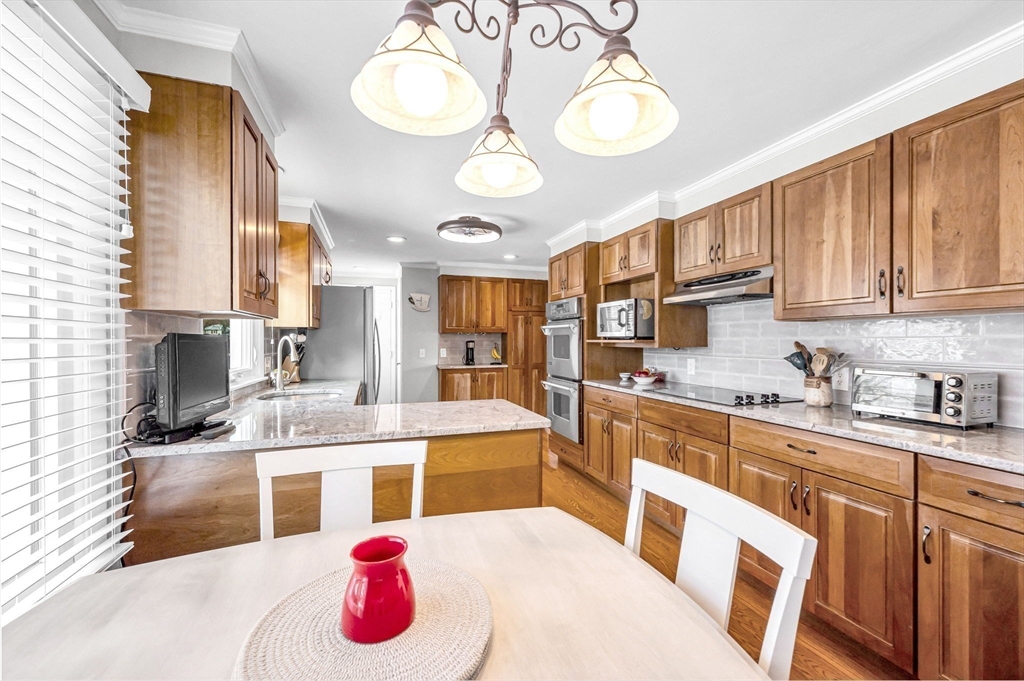 361 Frank Smith Road Longmeadow, MA 01106 - Photo 6 of 42 a kitchen with a sink stove and cabinets