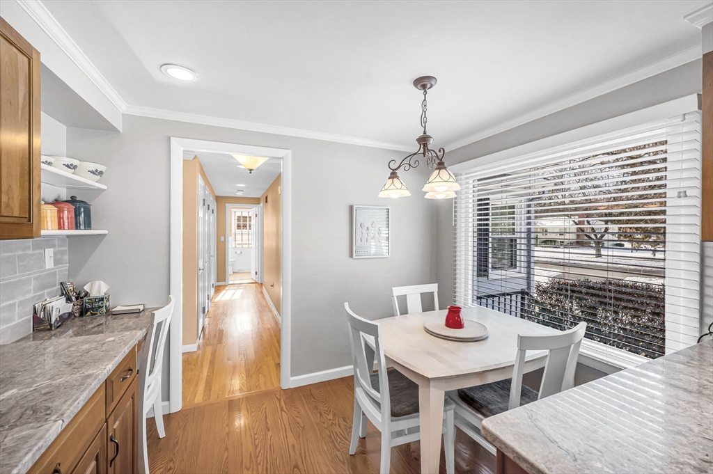 361 Frank Smith Road Longmeadow, MA 01106 - Photo 8 of 42 a dining room with furniture a chandelier and wooden floor