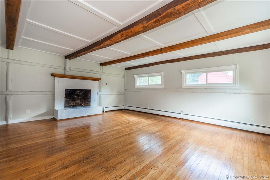 279 Fenn Road Cheshire, CT 06410 - Photo 12 of 28 a view of an empty room with wooden floor and a window