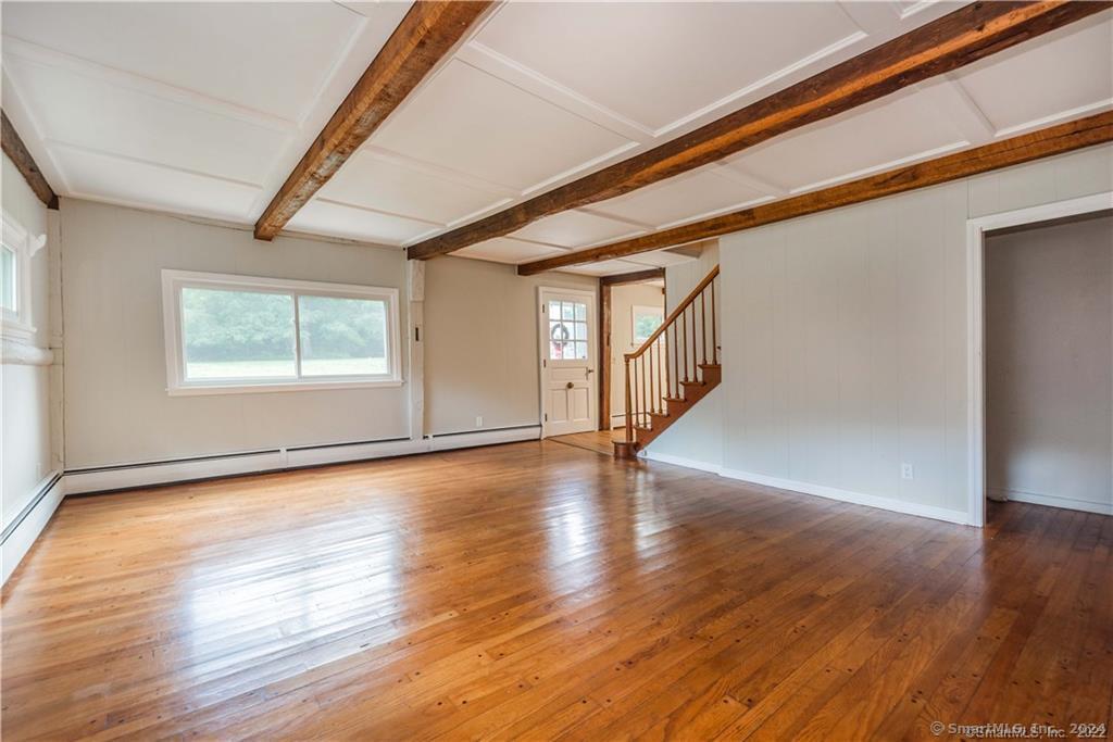 279 Fenn Road Cheshire, CT 06410 - Photo 14 of 28 a view of an empty room with wooden floor and a window