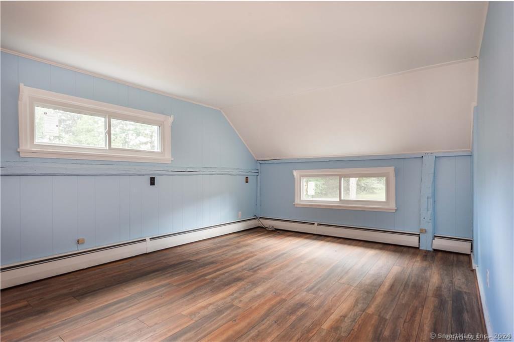 279 Fenn Road Cheshire, CT 06410 - Photo 17 of 28 an empty room with wooden floor and windows
