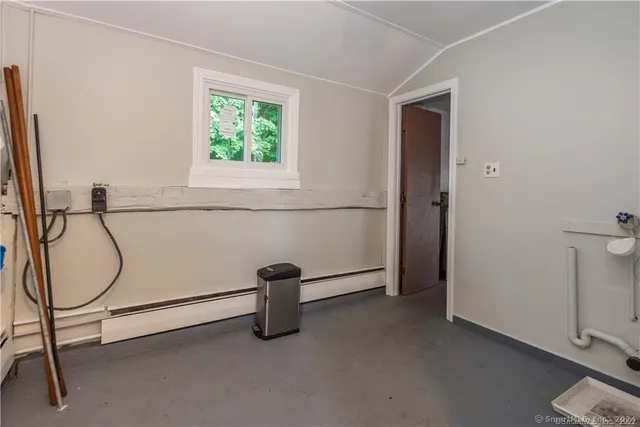 a view of an empty room with windows