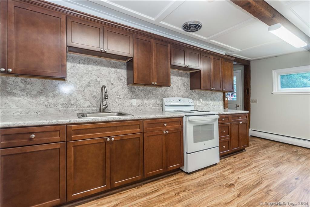 279 Fenn Road Cheshire, CT 06410 - Photo 8 of 28 a kitchen with stainless steel appliances granite countertop a sink a stove a refrigerator and cabinets