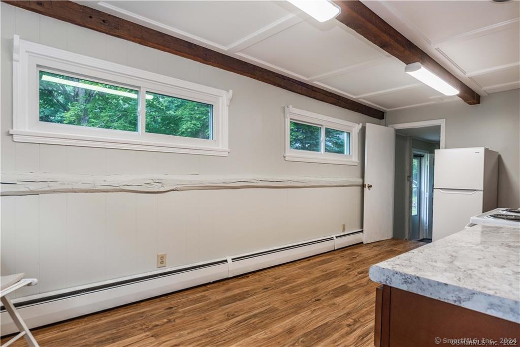 279 Fenn Road Cheshire, CT 06410 - Photo 10 of 28 a view of a kitchen cabinets and wooden floor