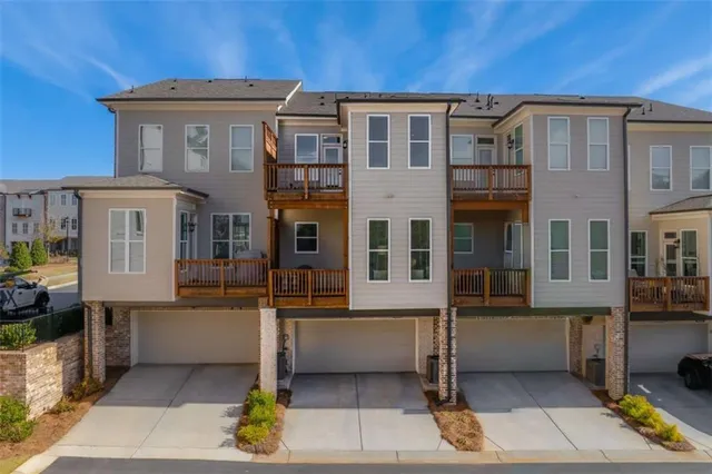 a front view of a house with glass windows