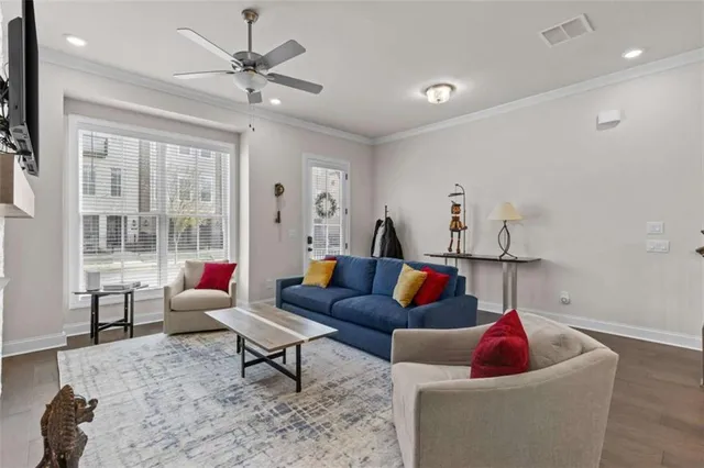 a living room with furniture and a large window