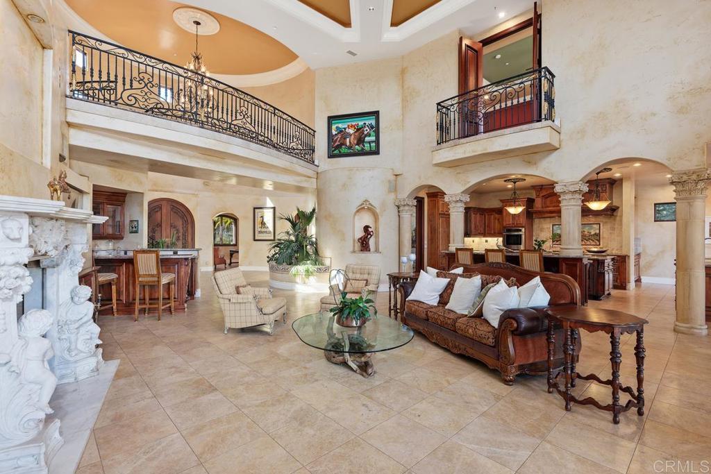 4633 Olive Hill Road Fallbrook, CA 92028 - Photo 6 of 10 a living room with patio furniture and a large window
