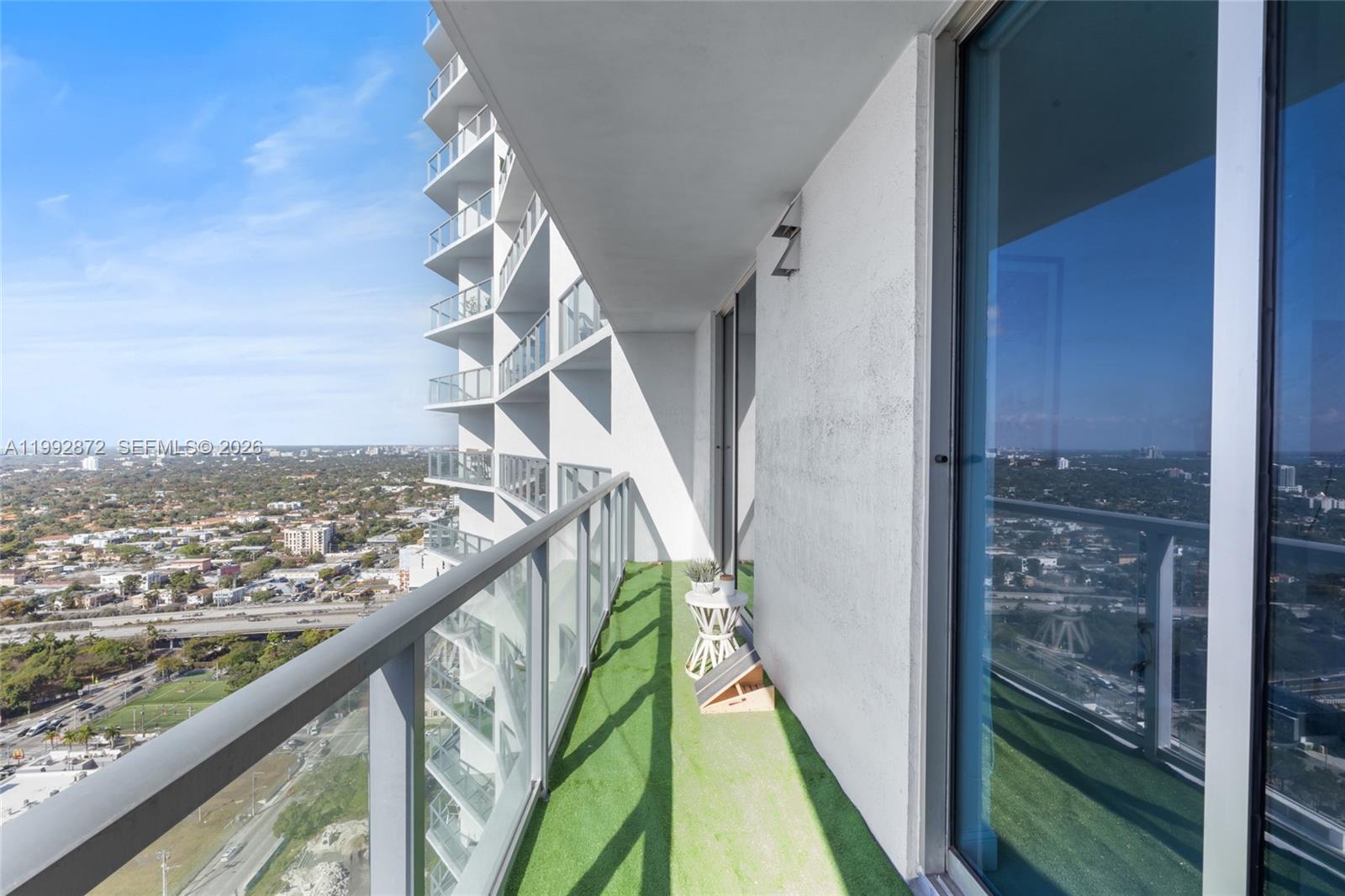 185 Southwest 7th Street, Unit 3414 Miami, FL 33130 - Photo 25 of 32 a view of a balcony with an ocean view